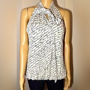 White House Black Market tie neck sleeveless blouse. Writing in black. SZ. M